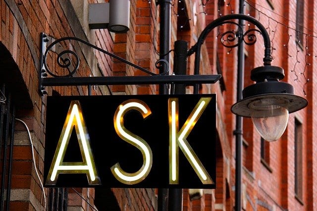A huge signpost with the word "ask" written on it