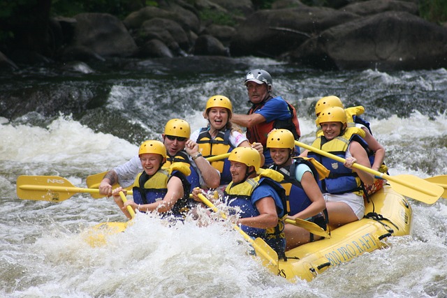 A team of people water rafting in an Utah river
