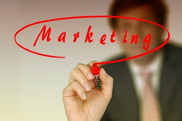The word marketing written with a marker