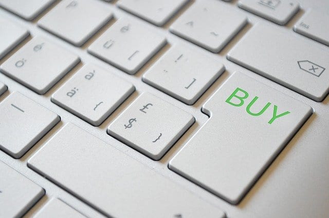 A laptop keyboard with an enter-buy button