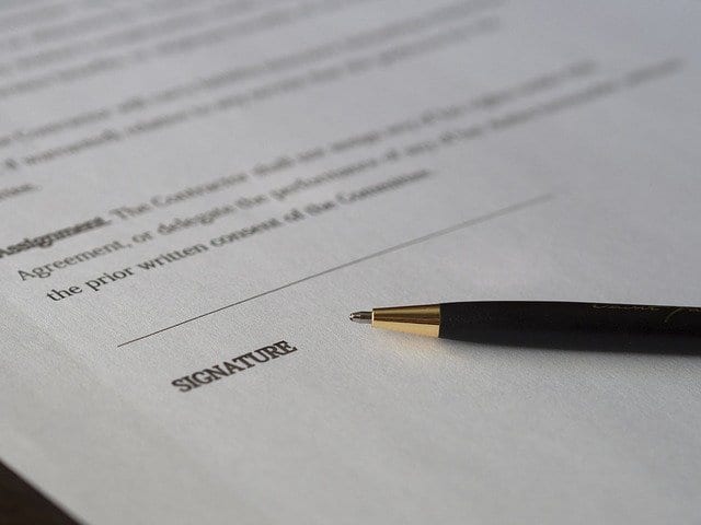 A pen on a paper indicating the end of an FSBO house purchase