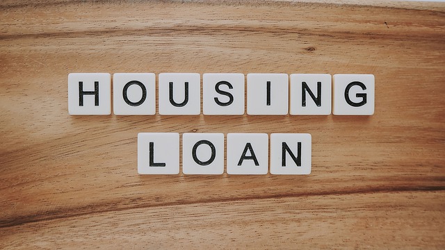 The word housing loan written with tiles