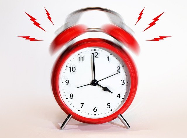 An alarm clock indicating a pre-foreclosure deadline is near
